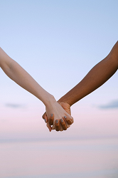 two people holding hands in support of each other